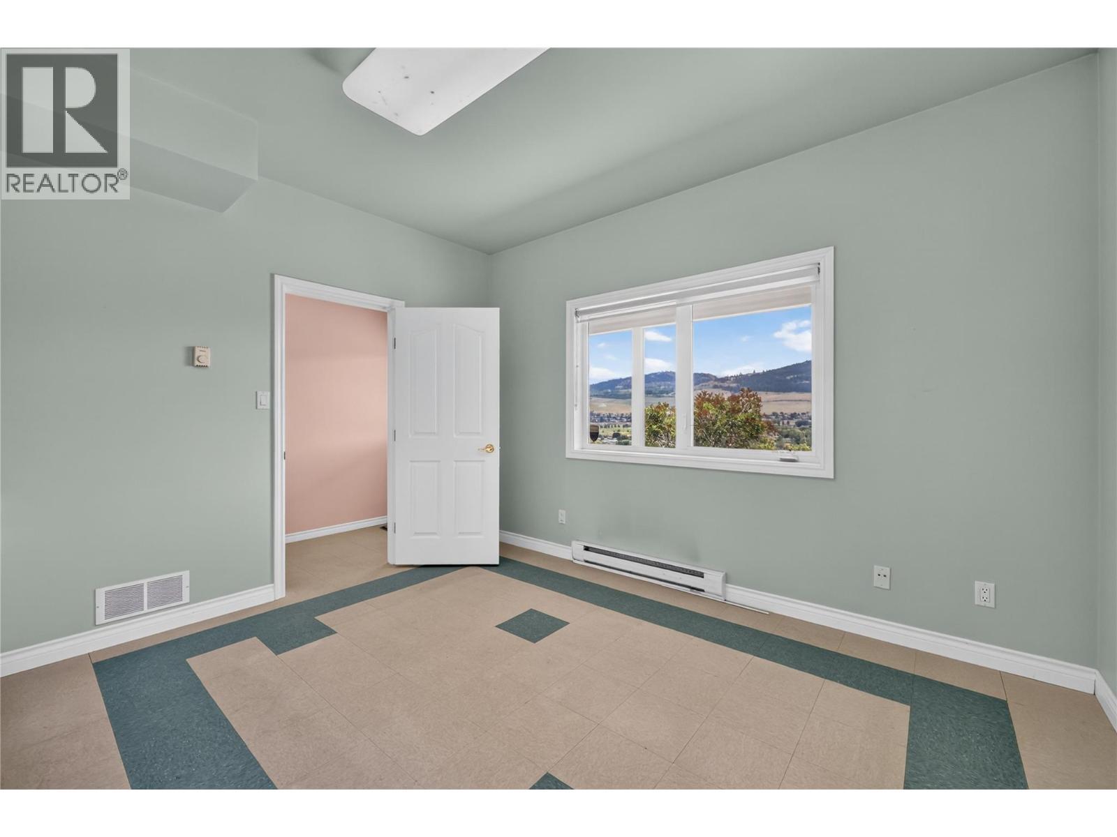 Bar bonus room with endless possibilities. Perfect as a speakeasy, an art studio, hobby room, fitness space, or entertaining lounge. - 7083 Jasper Drive, Vernon, BC - Indoor Photo Showing Other Room