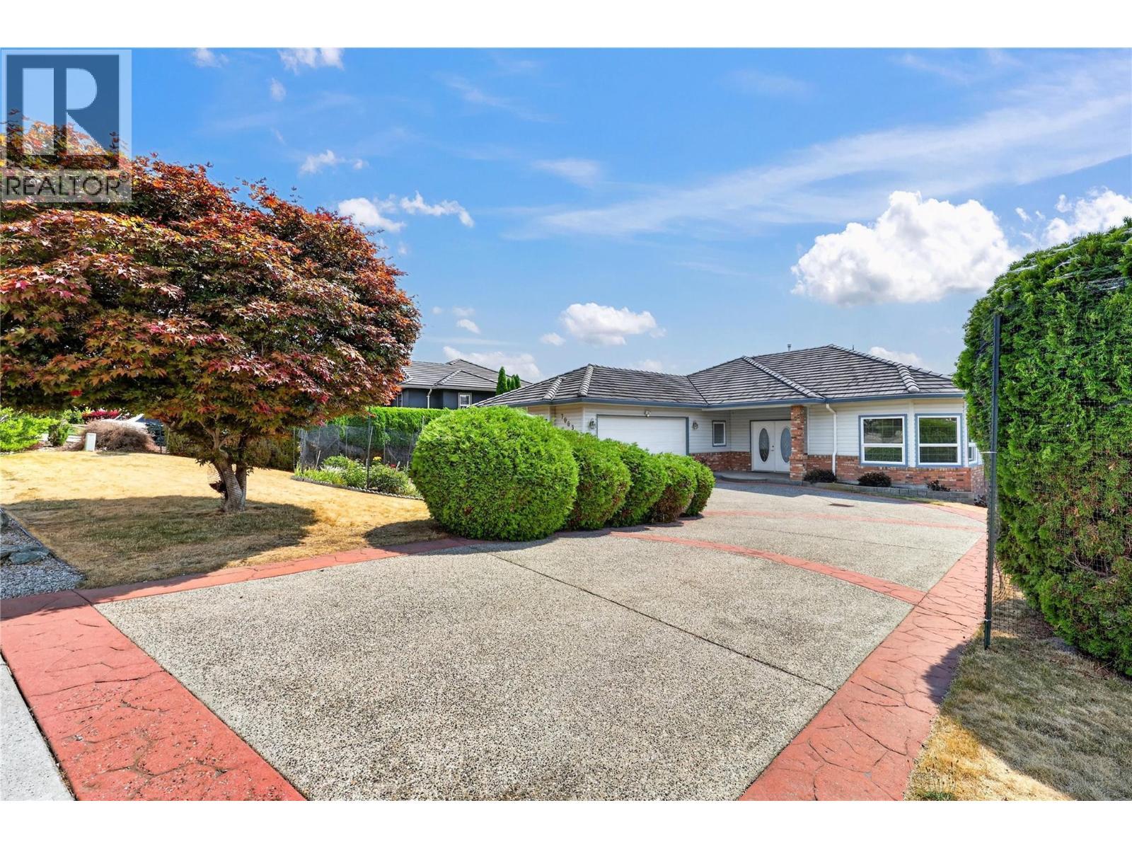 Beautifully landscaped yards. - 7083 Jasper Drive, Vernon, BC - Outdoor