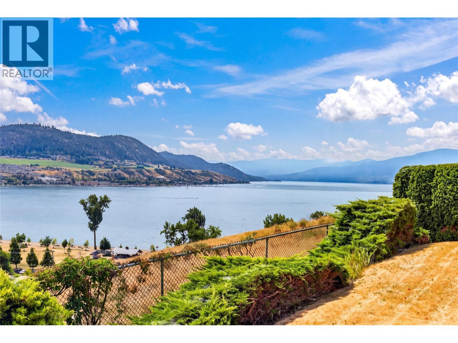 Stunning views of Okanagan Lake. - 7083 Jasper Drive, Vernon, BC - Outdoor With Body Of Water With View