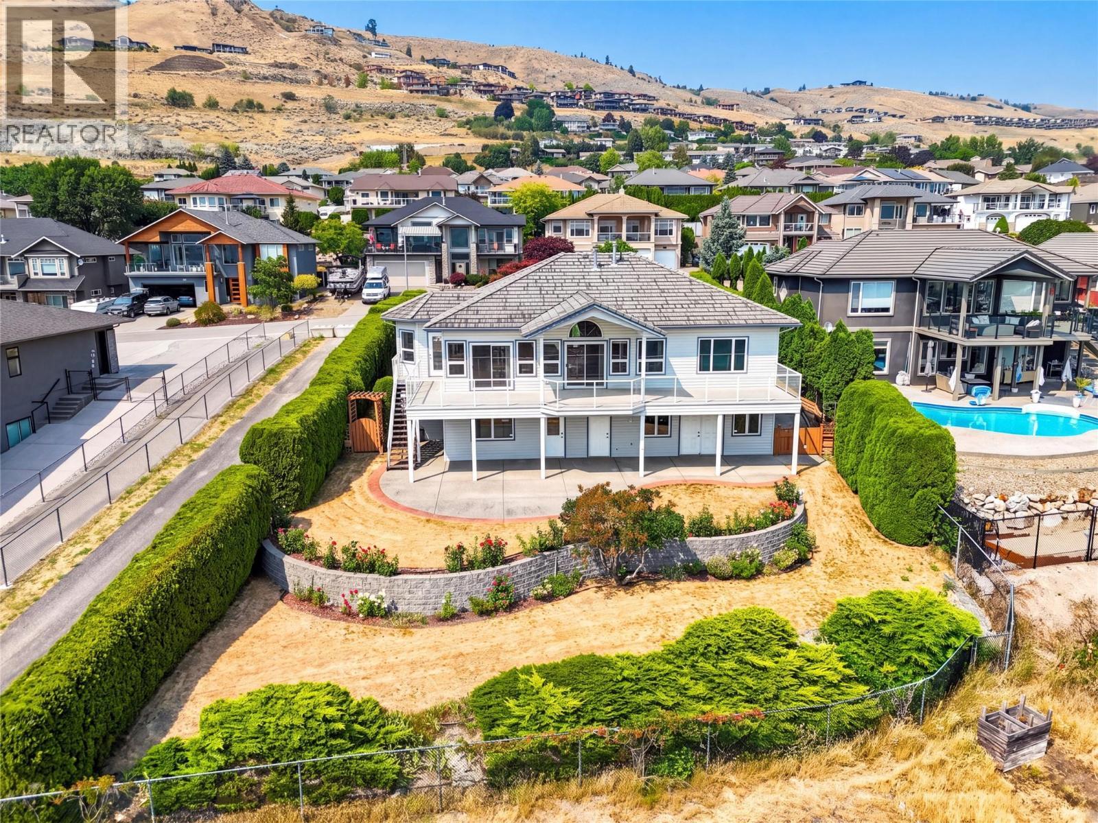 Perched on this tiered lawn, on a quiet cul-de-sac, over-looking Okanagan Lake. - 7083 Jasper Drive, Vernon, BC - Outdoor