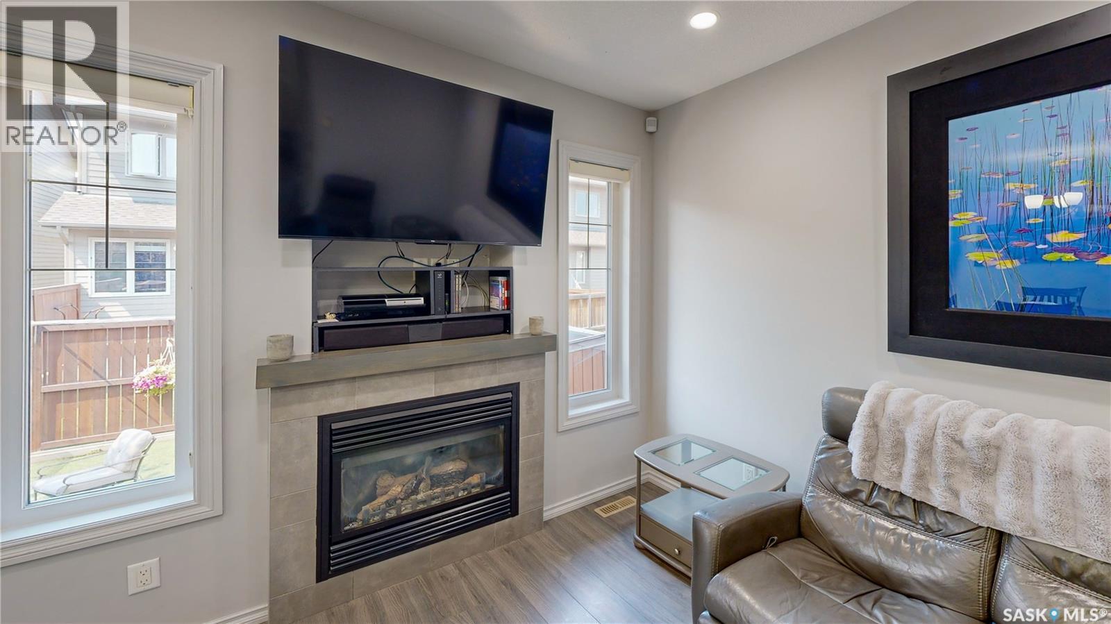 134 4100 Sandhill Crescent, Regina, SK - Indoor Photo Showing Living Room With Fireplace