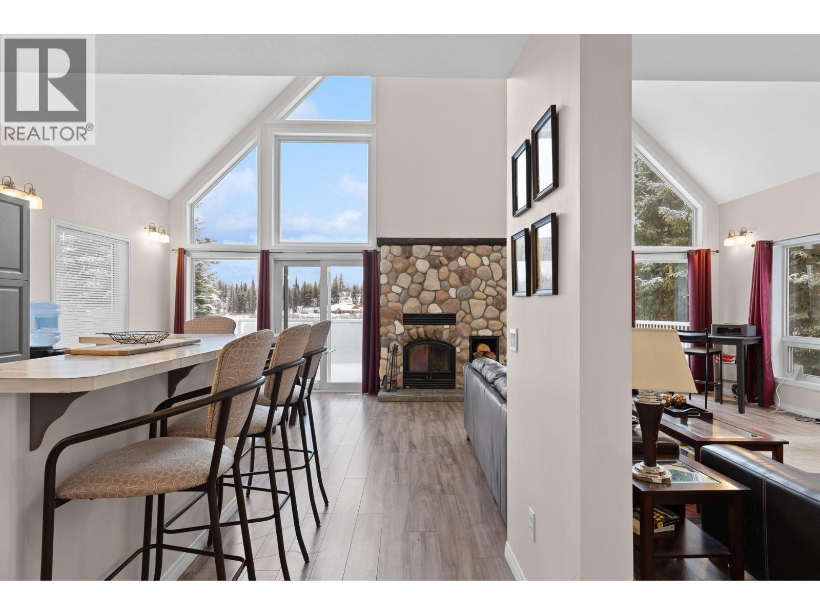 9315 Paradise Road, Kelowna, BC - Indoor Photo Showing Dining Room With Fireplace