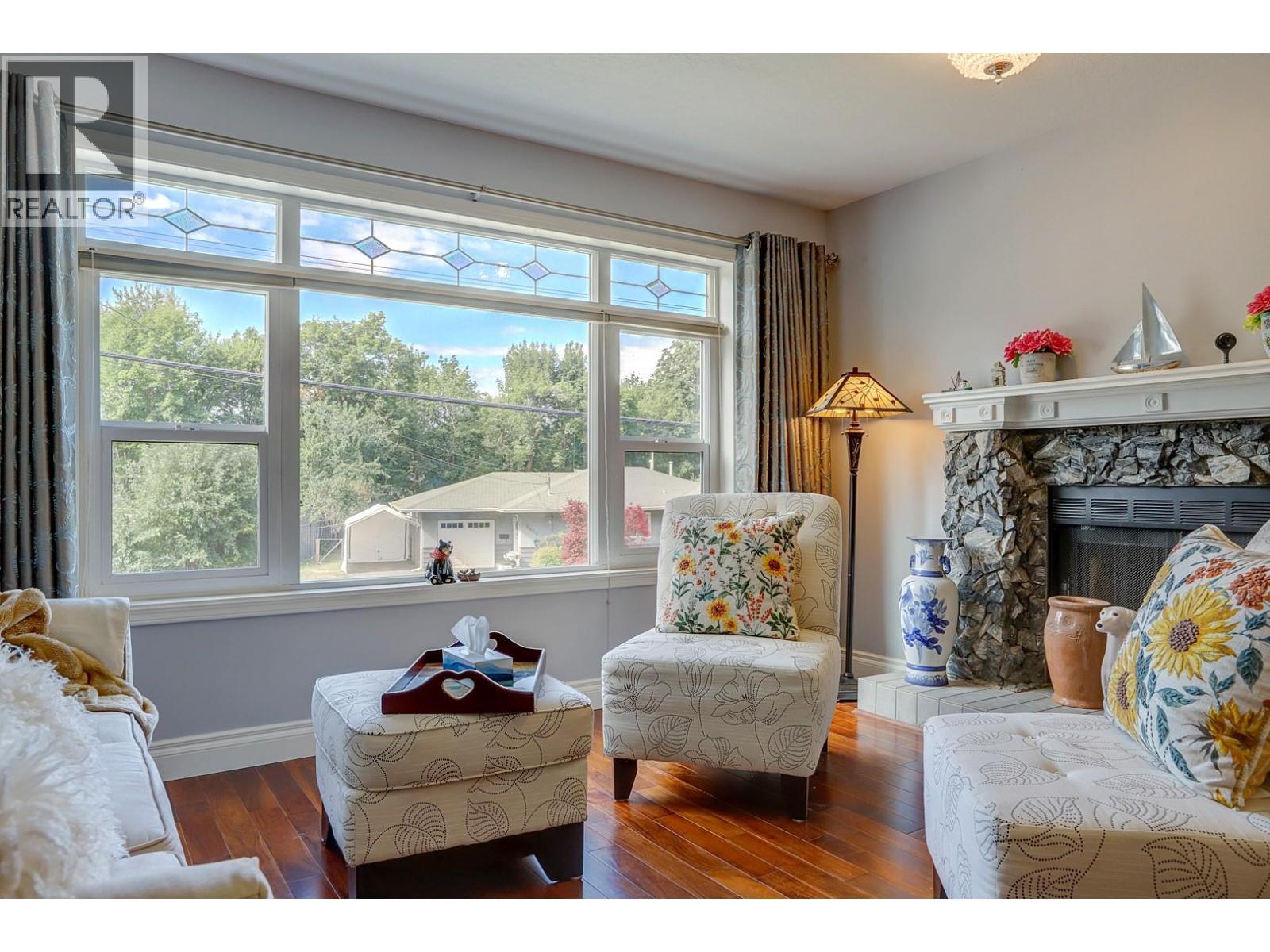 8405 Postill Drive, Coldstream, BC - Indoor Photo Showing Living Room With Fireplace
