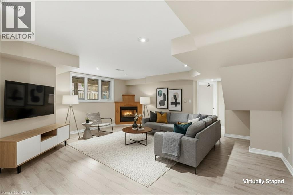 In-Law Suite Virtually Staged - 5 Manor Crescent, Grimsby, ON - Indoor Photo Showing Living Room With Fireplace