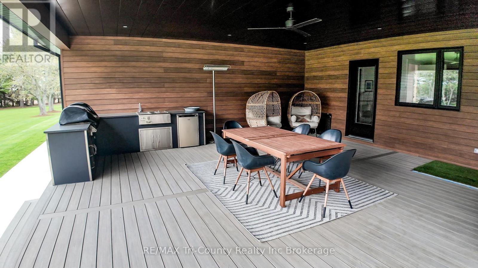 Covered patio and built in kitchen - 8987 Powers Road, Central Elgin, ON - Outdoor With Deck Patio Veranda With Exterior