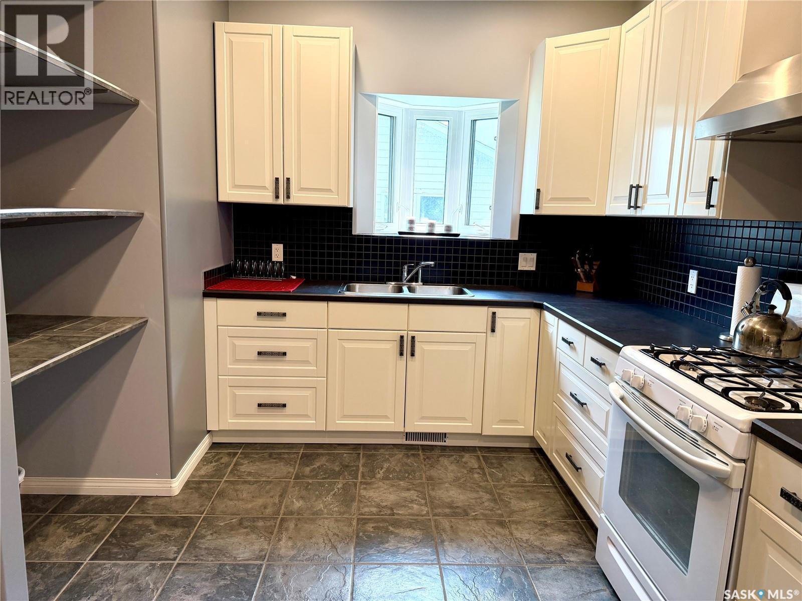 123 Chitek Drive, Chitek Lake, SK - Indoor Photo Showing Kitchen With Double Sink