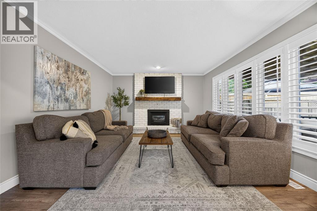 395 Brooktree Drive, St Clair, ON - Indoor Photo Showing Living Room With Fireplace