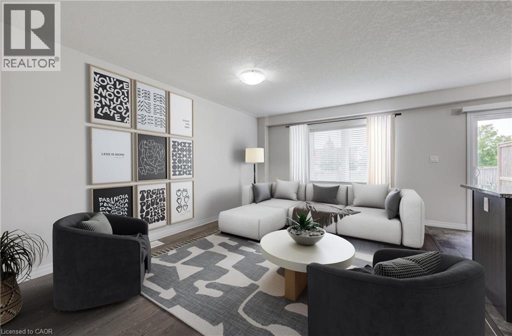 Spacious living area featuring wood-finish flooring, a large window with blinds, and a glass-paneled door leading to an outdoor area - 823 Paris Boulevard, Waterloo, ON - Indoor Photo Showing Living Room