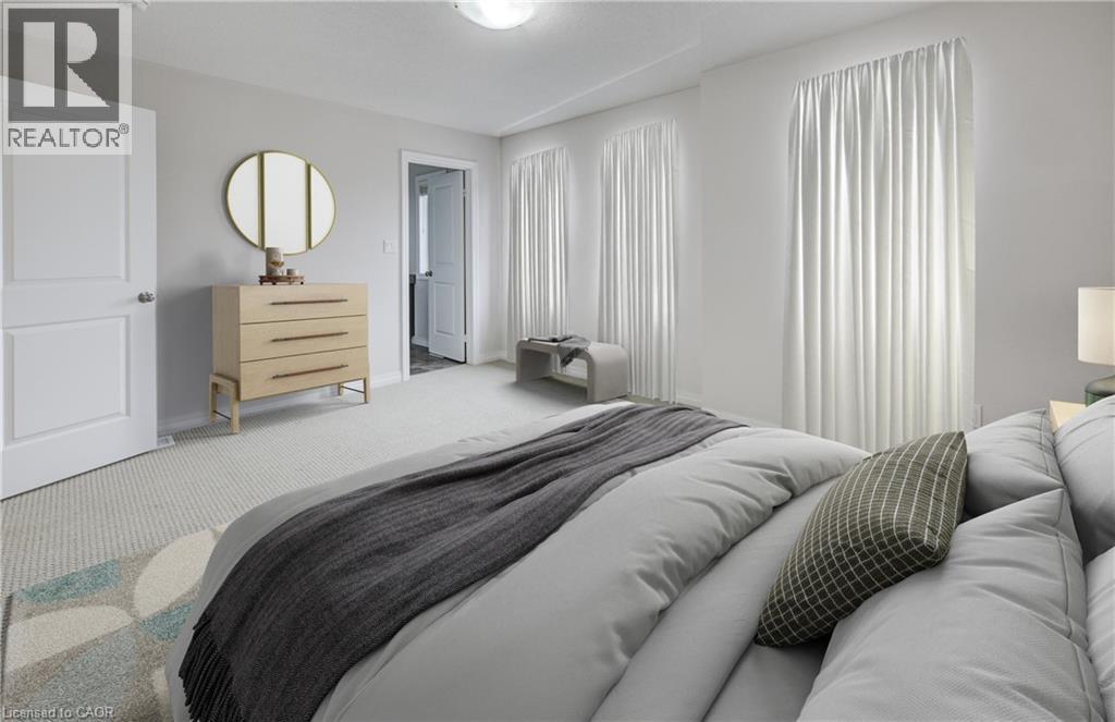 Light-toned walls complement the neutral carpet flooring - 823 Paris Boulevard, Waterloo, ON - Indoor Photo Showing Bedroom