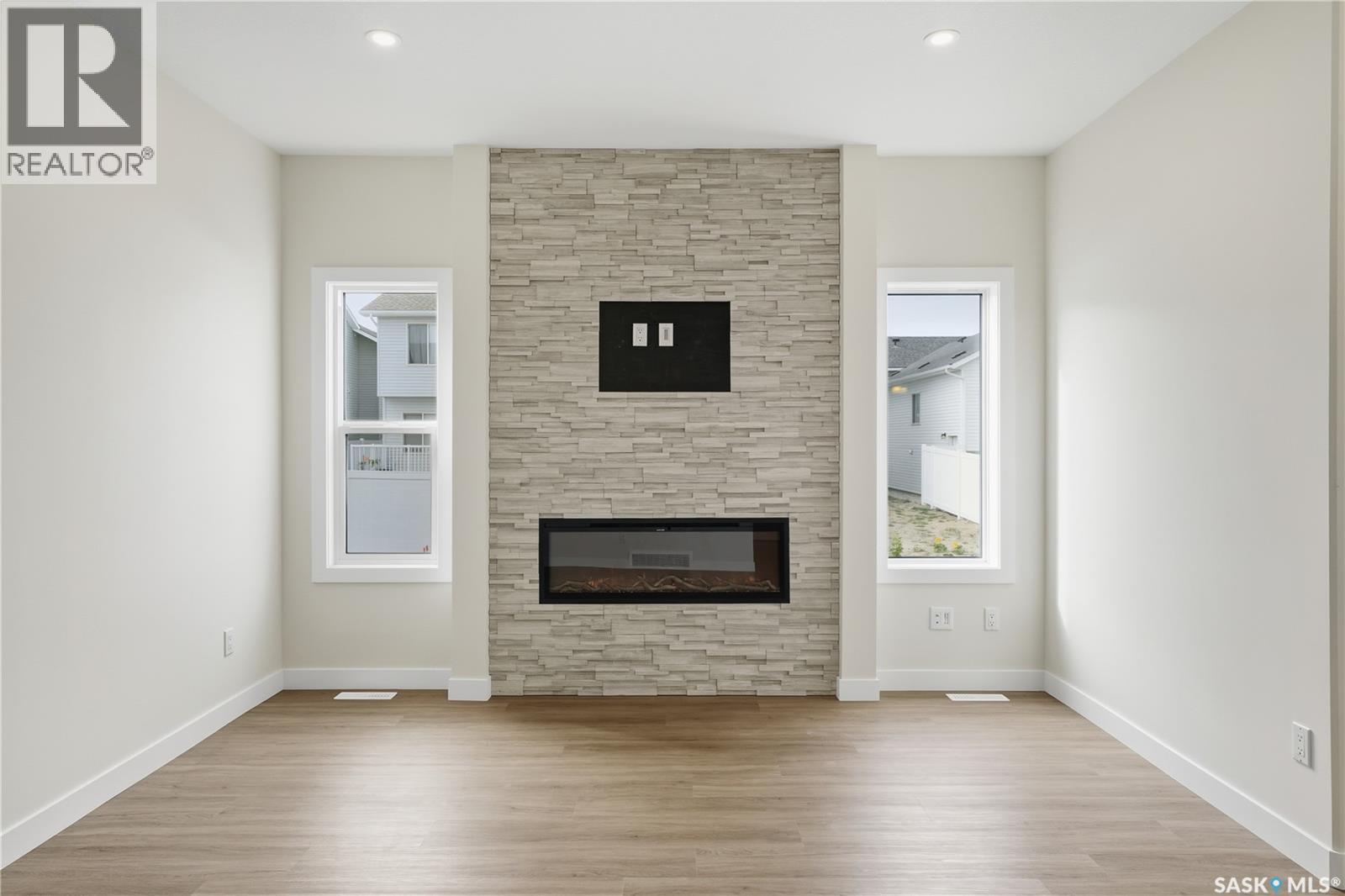 692 Nazarali Lane, Saskatoon, SK - Indoor Photo Showing Living Room With Fireplace