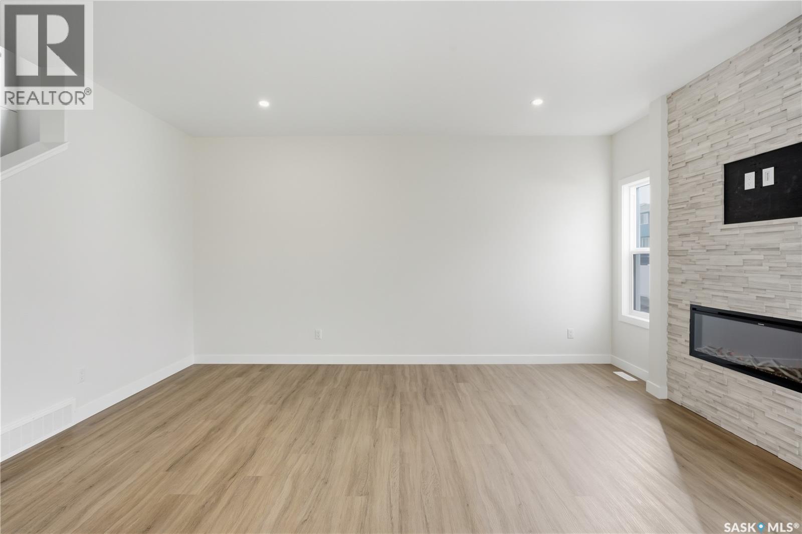 692 Nazarali Lane, Saskatoon, SK - Indoor With Fireplace
