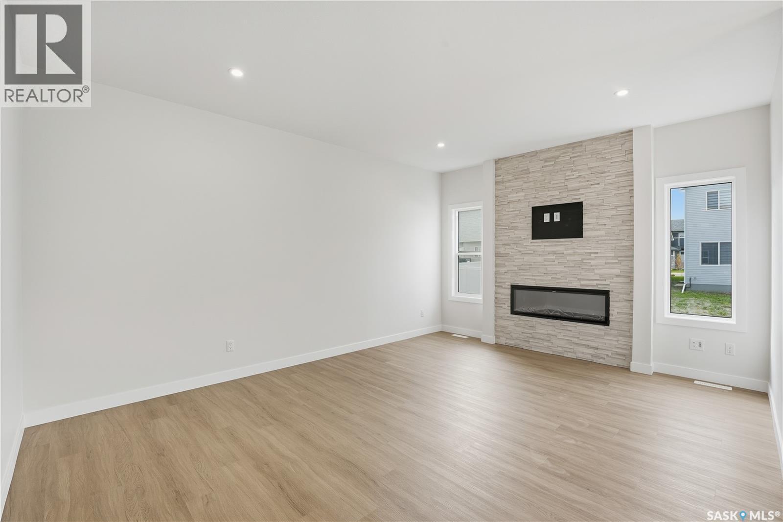 692 Nazarali Lane, Saskatoon, SK - Indoor Photo Showing Living Room With Fireplace