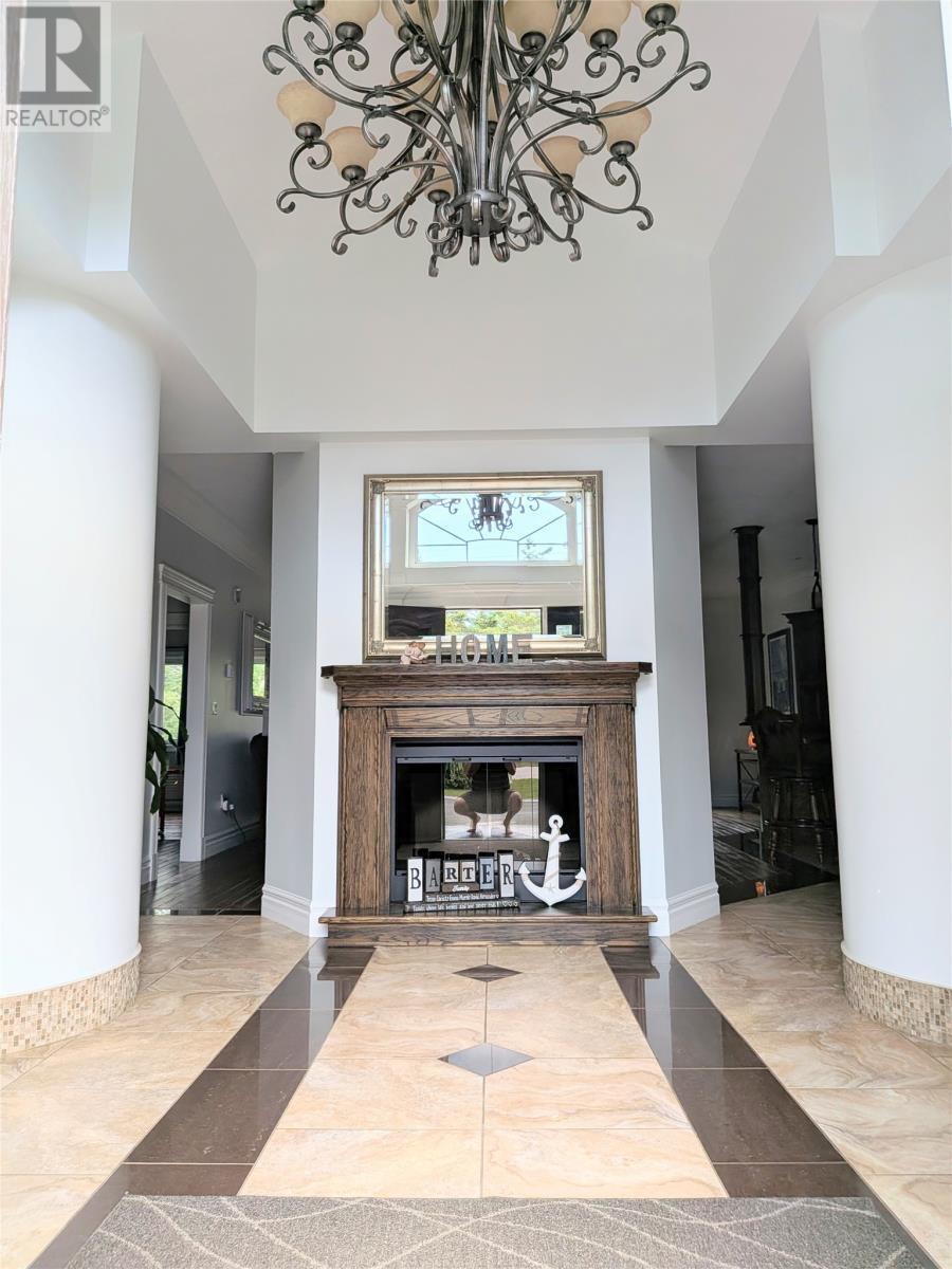23 Seaside Drive, Kippens, NL - Indoor With Fireplace