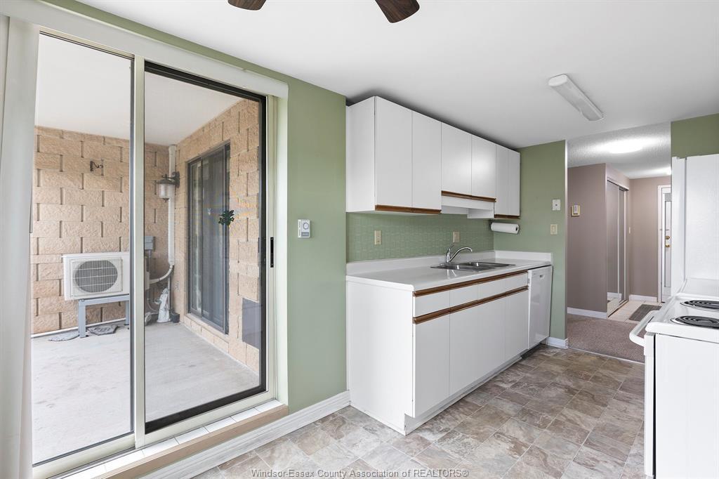 502-1905 Normandy, Lasalle, ON - Indoor Photo Showing Kitchen With Double Sink