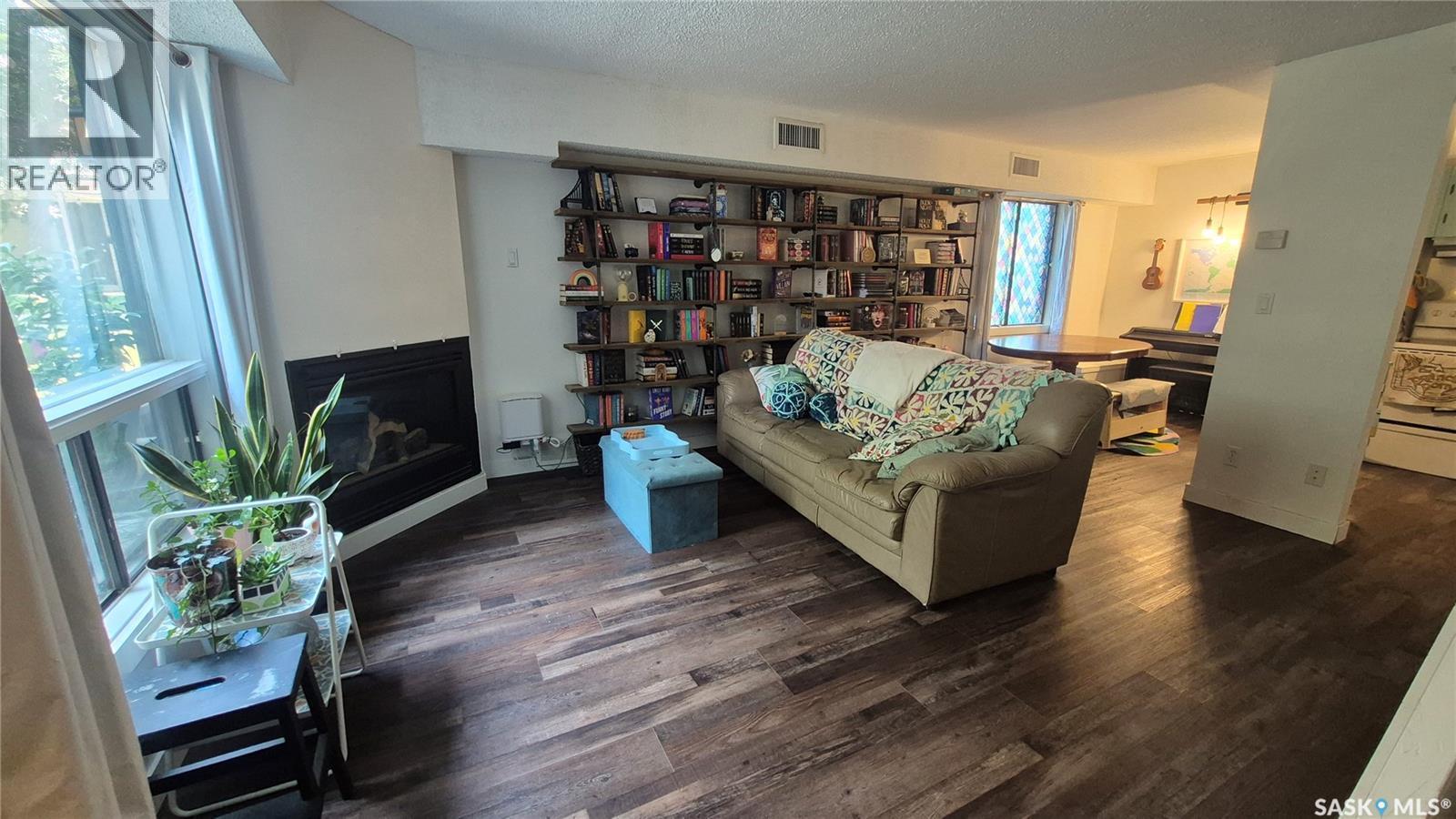 66 Gore Place, Regina, SK - Indoor Photo Showing Living Room With Fireplace