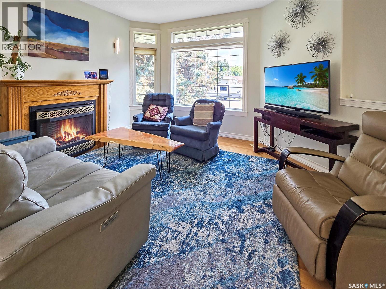 42 Willow Crescent, Fort Qu'Appelle, SK - Indoor Photo Showing Living Room With Fireplace