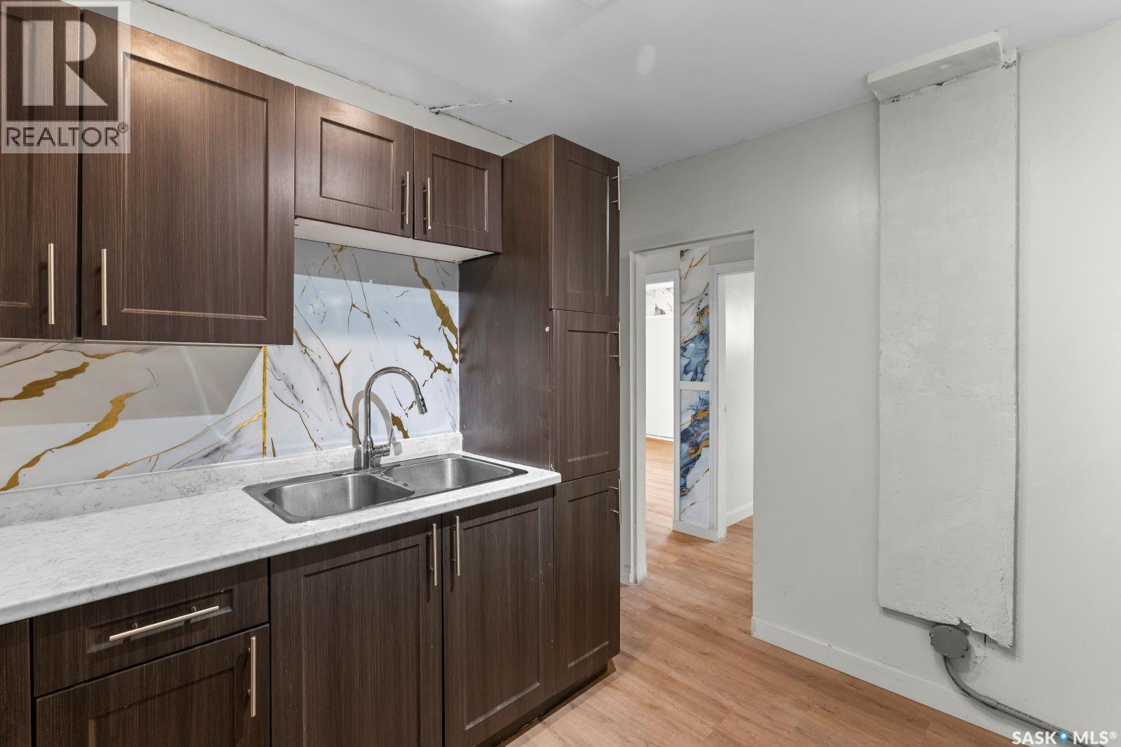 410 P Avenue N, Saskatoon, SK - Indoor Photo Showing Kitchen With Double Sink