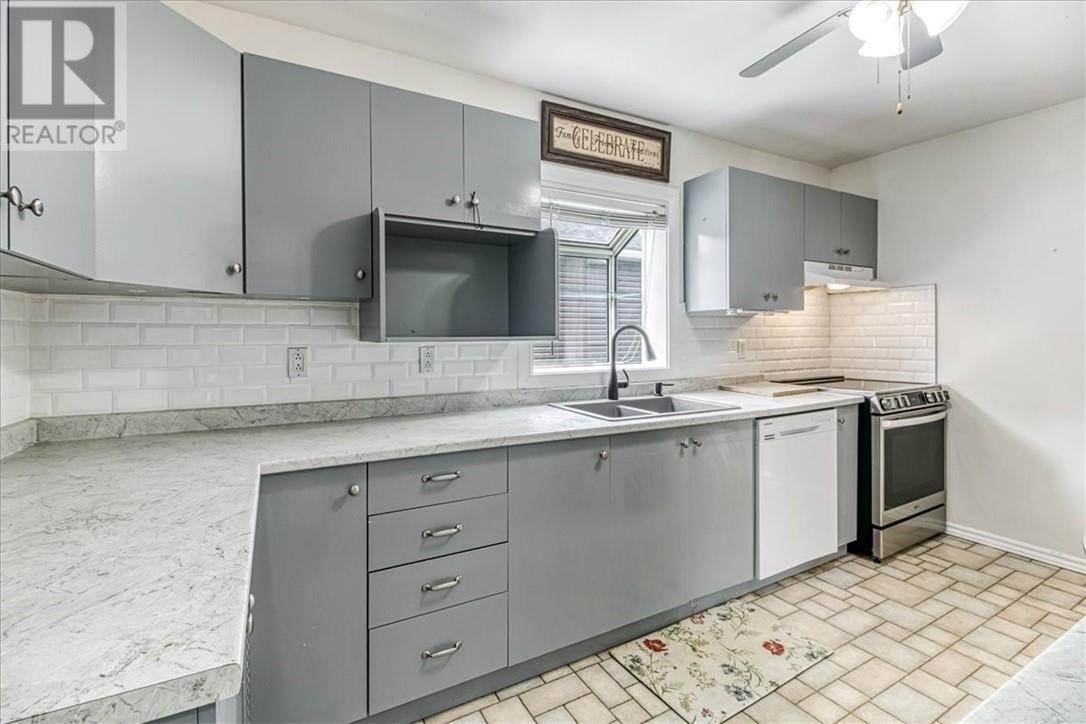 75 O'Donaghue Drive, Garson, ON - Indoor Photo Showing Kitchen With Double Sink