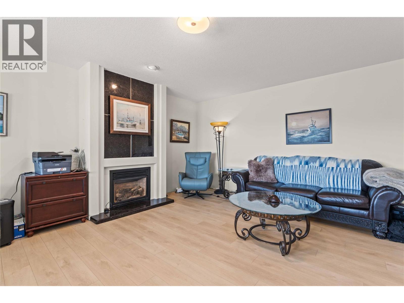 759 Middleton Way, Coldstream, BC - Indoor Photo Showing Living Room With Fireplace