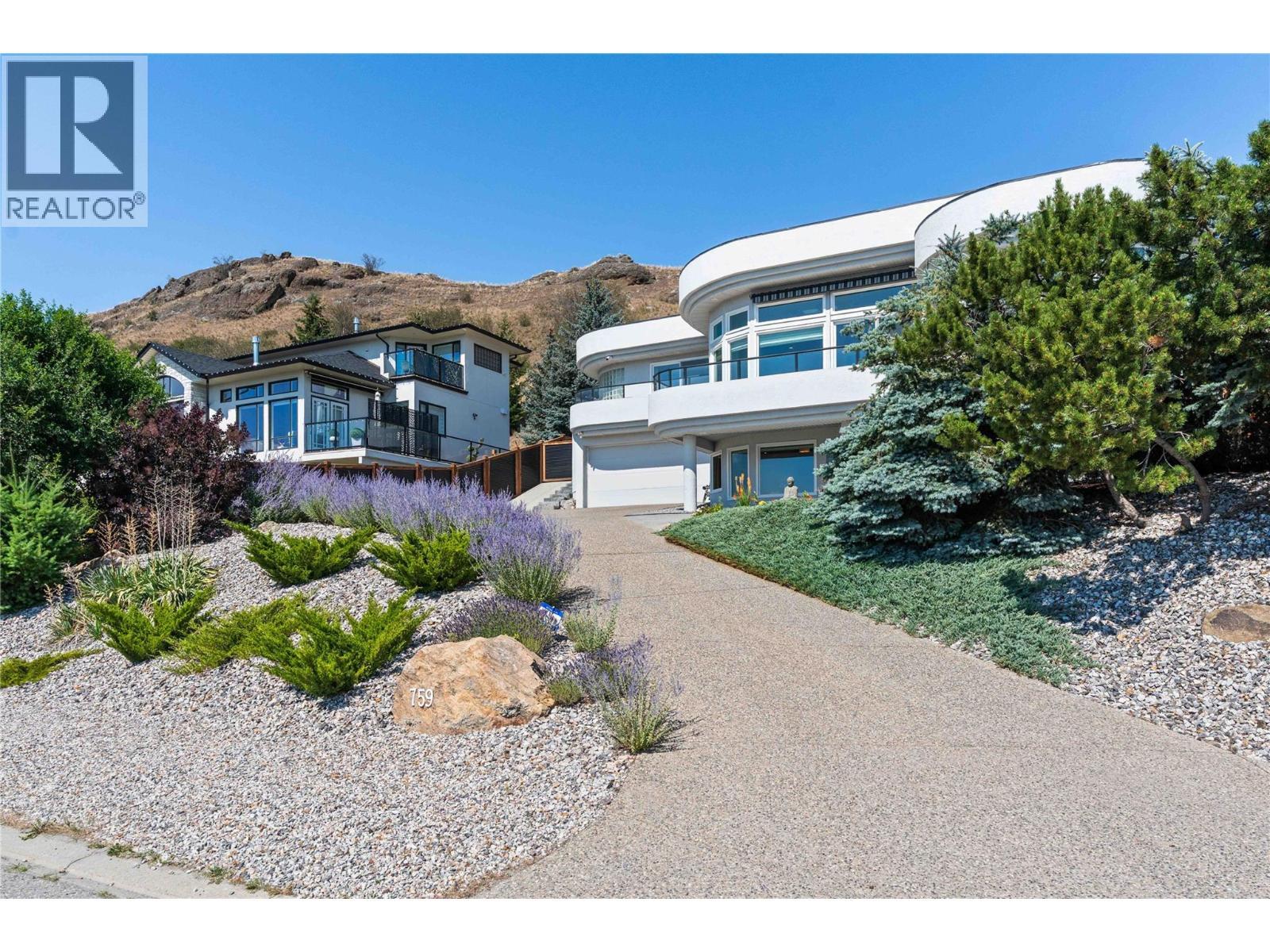 Newly landscaped low maintenance yard and extended driveway. - 759 Middleton Way, Coldstream, BC - Outdoor