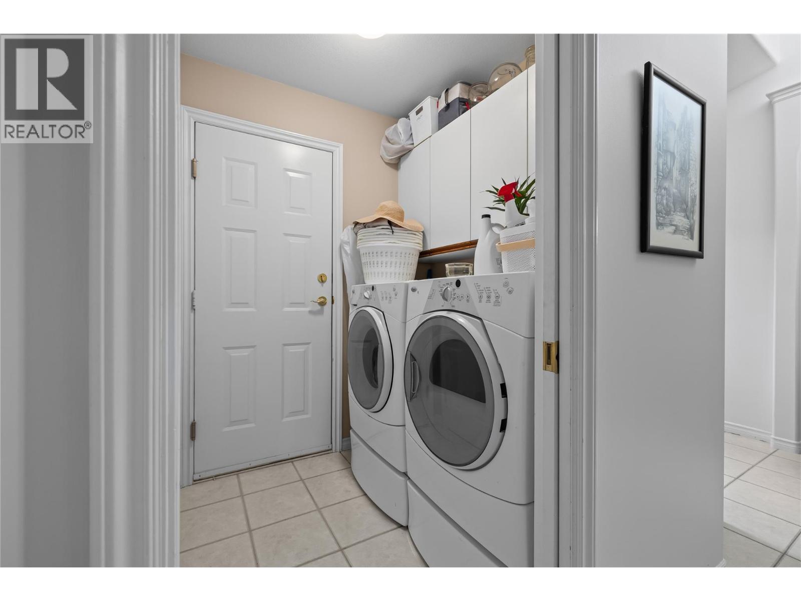 Laundry Room with garage access - 3889 Gallaghers Grange, Kelowna, BC - Indoor Photo Showing Laundry Room