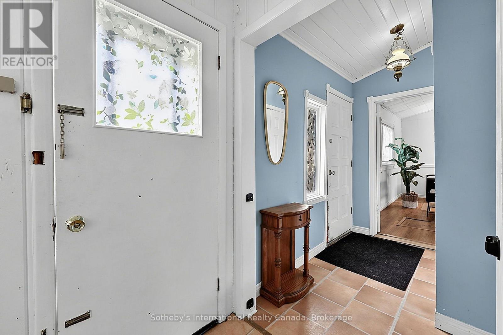 Foyer w/main door and secondary patio door - 32 Tiny Beaches Road N, Tiny, ON - Indoor Photo Showing Other Room