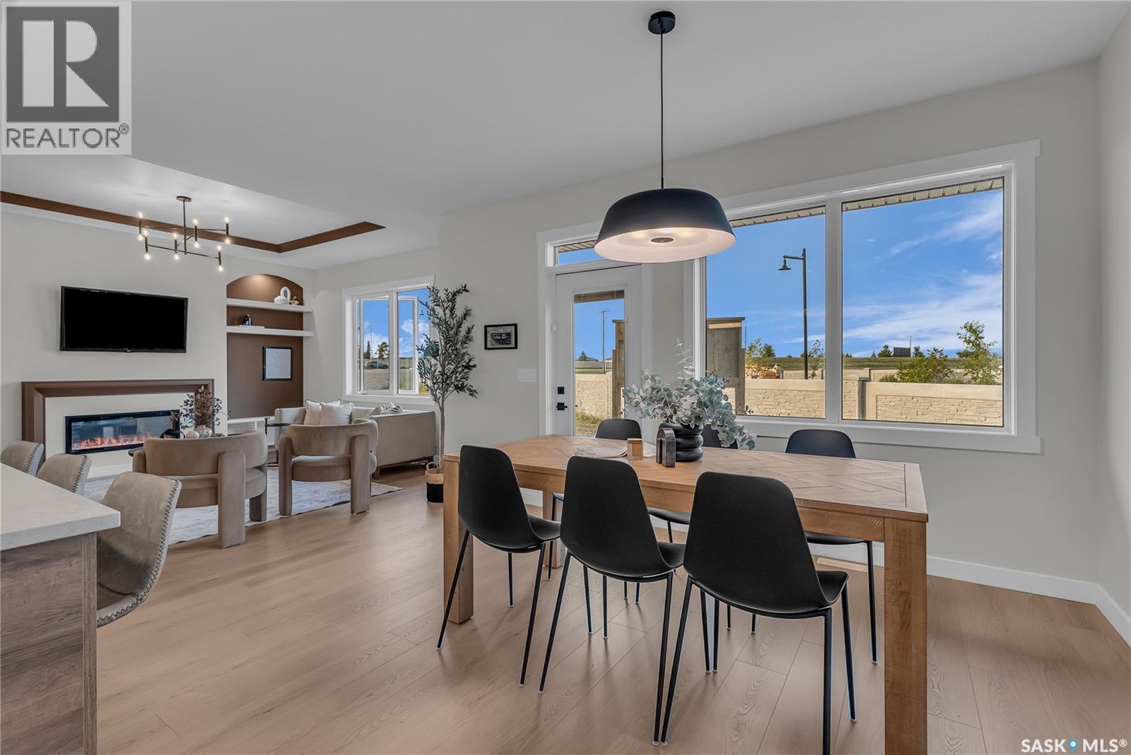 463 Traeger Close, Saskatoon, SK - Indoor Photo Showing Dining Room With Fireplace