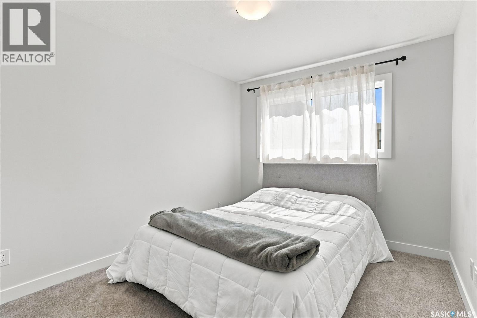 65 651 Dubois Crescent, Saskatoon, SK - Indoor Photo Showing Bedroom