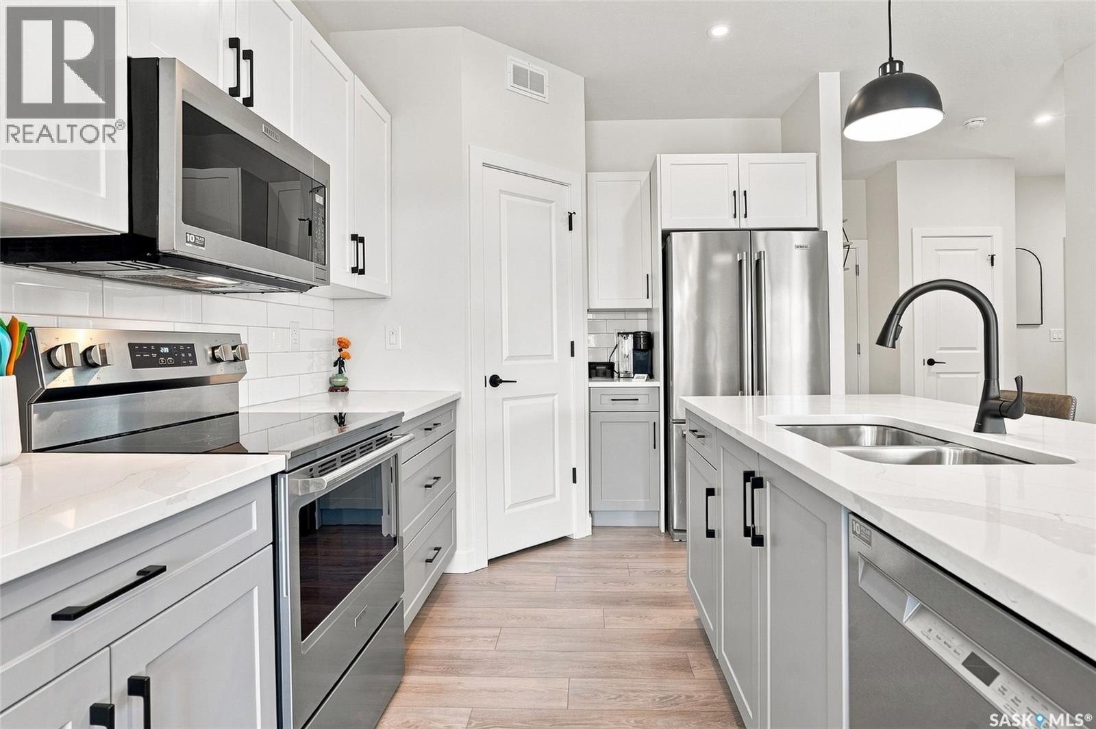 65 651 Dubois Crescent, Saskatoon, SK - Indoor Photo Showing Kitchen With Stainless Steel Kitchen With Double Sink With Upgraded Kitchen