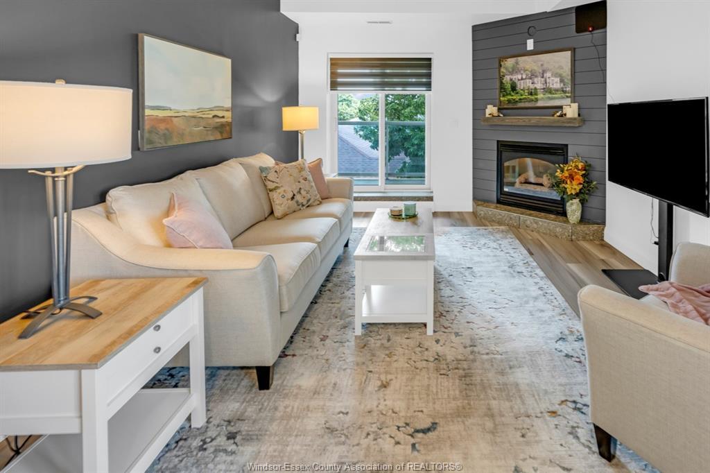 306-4850 Grand Boulevard, Windsor, ON - Indoor Photo Showing Living Room With Fireplace