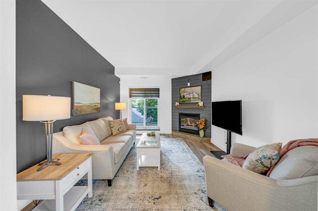 306-4850 Grand Boulevard, Windsor, ON - Indoor Photo Showing Living Room With Fireplace
