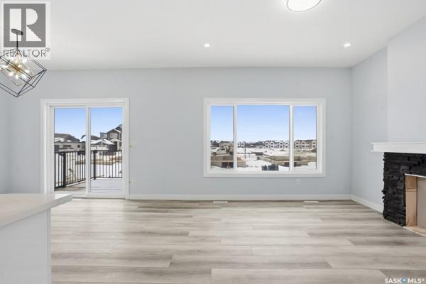 783 Nazarali Union, Saskatoon, SK - Indoor Photo Showing Other Room With Fireplace