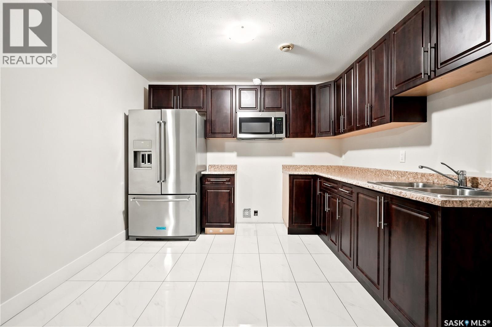 3325 Green Brook Road, Regina, SK - Indoor Photo Showing Kitchen With Double Sink