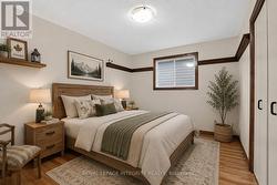 Virtually staged - Second bedroom with hardwood - 