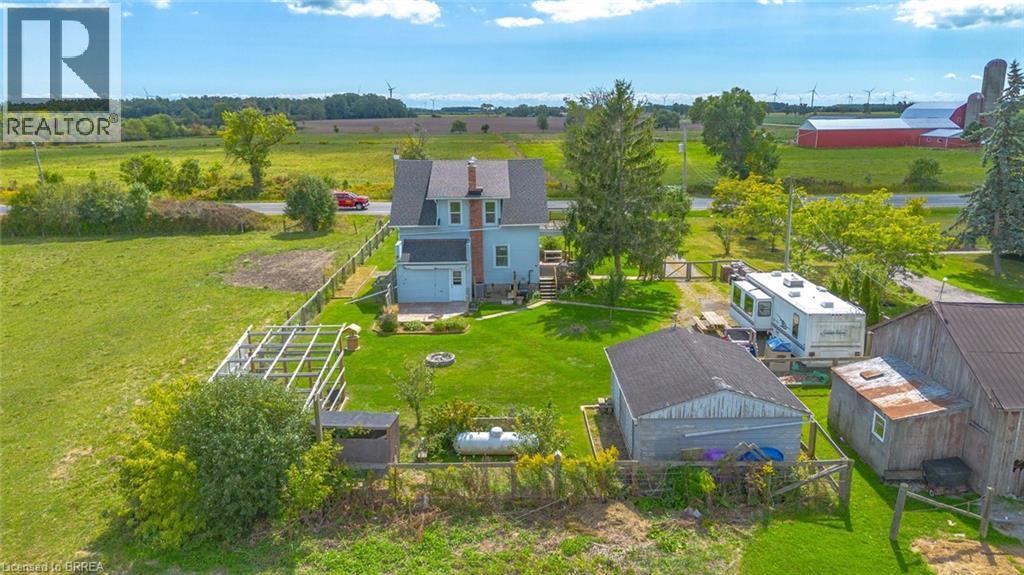Two-story residence with light blue siding and a dark shingle roof - 3211 Highway 3, Jarvis, ON - Outdoor With View