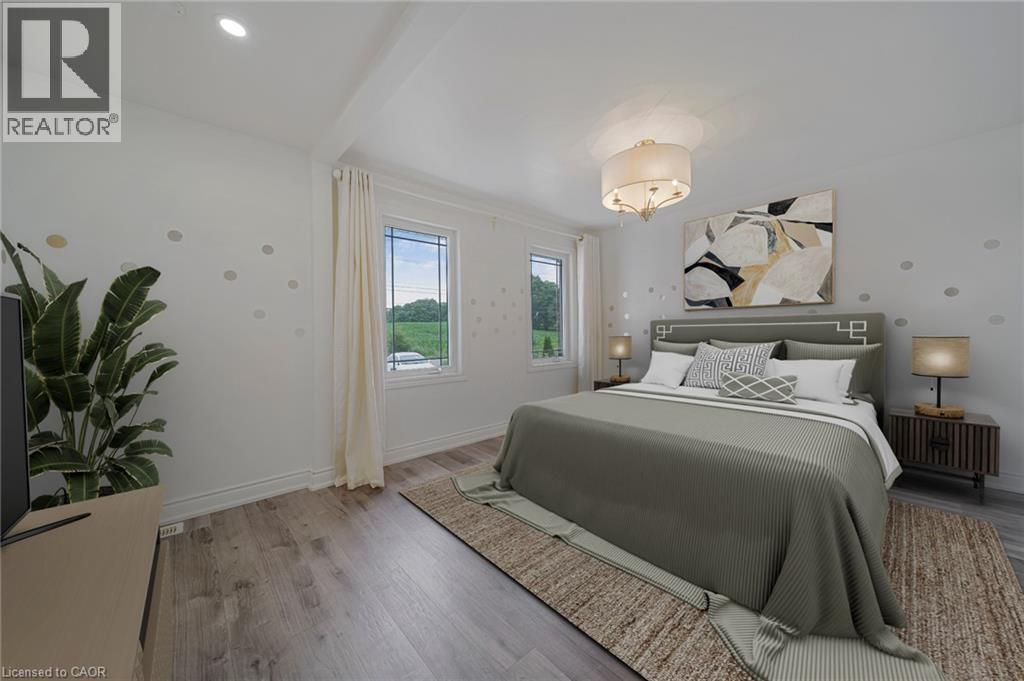 Bedroom featuring recessed lighting and a central drum chandelier - 7332 Twenty Road E, Glanbrook, ON - Indoor Photo Showing Bedroom