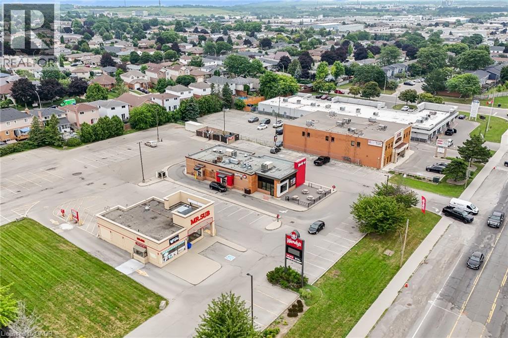 Commercial properties with expansive paved parking areas - 7332 Twenty Road E, Glanbrook, ON - Outdoor With View