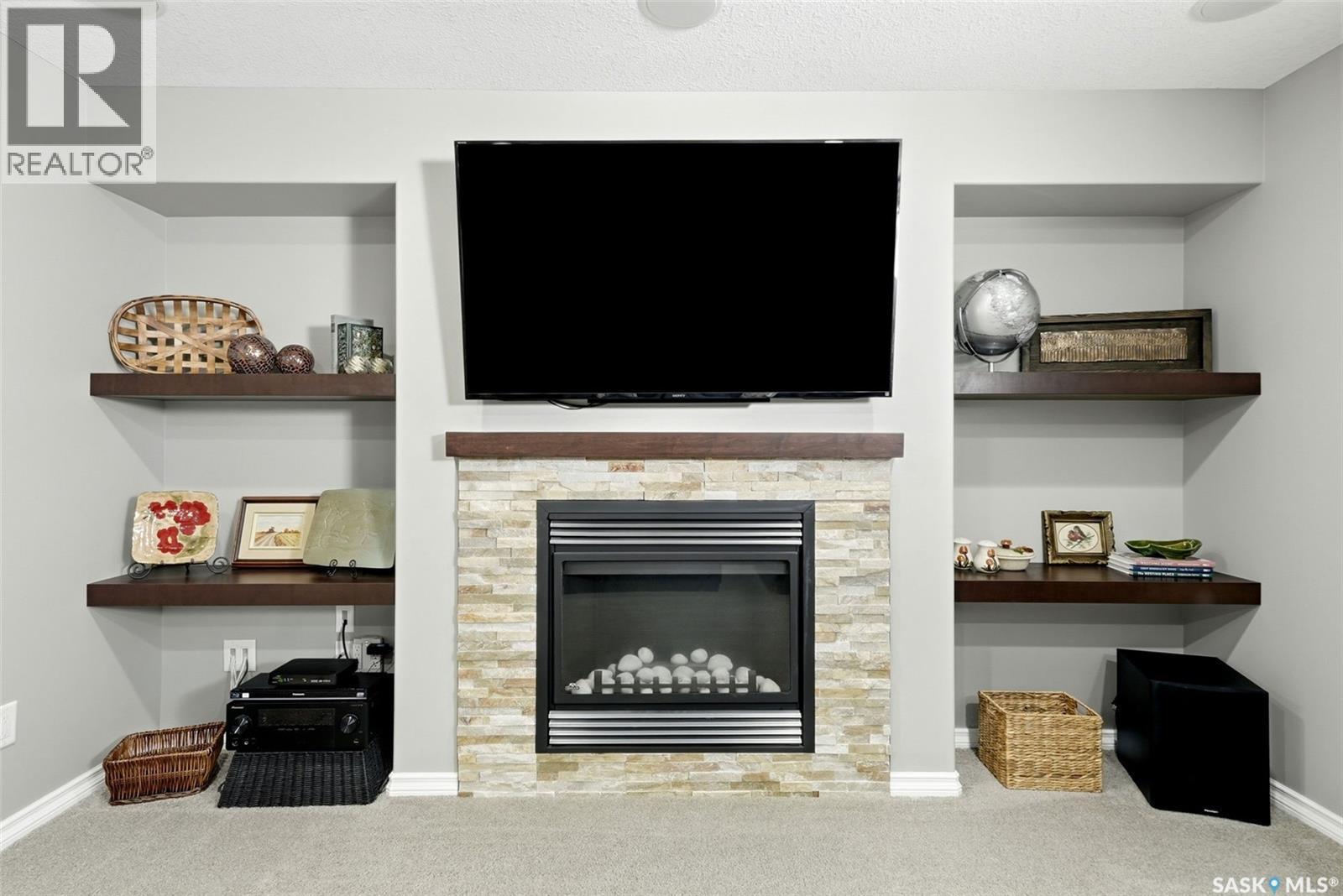 213 4002 Sandhill Crescent, Regina, SK - Indoor With Fireplace