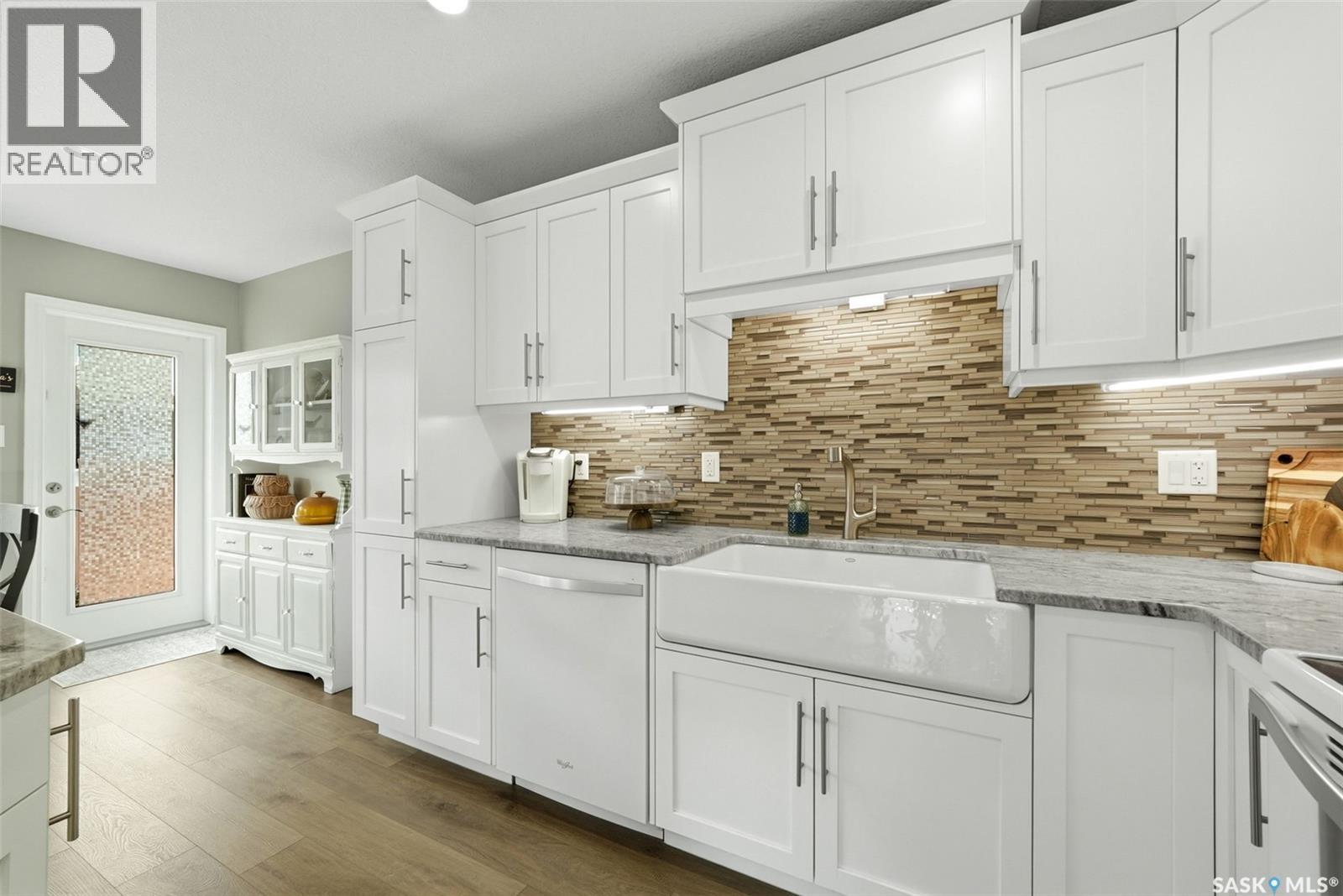 213 4002 Sandhill Crescent, Regina, SK - Indoor Photo Showing Kitchen With Double Sink
