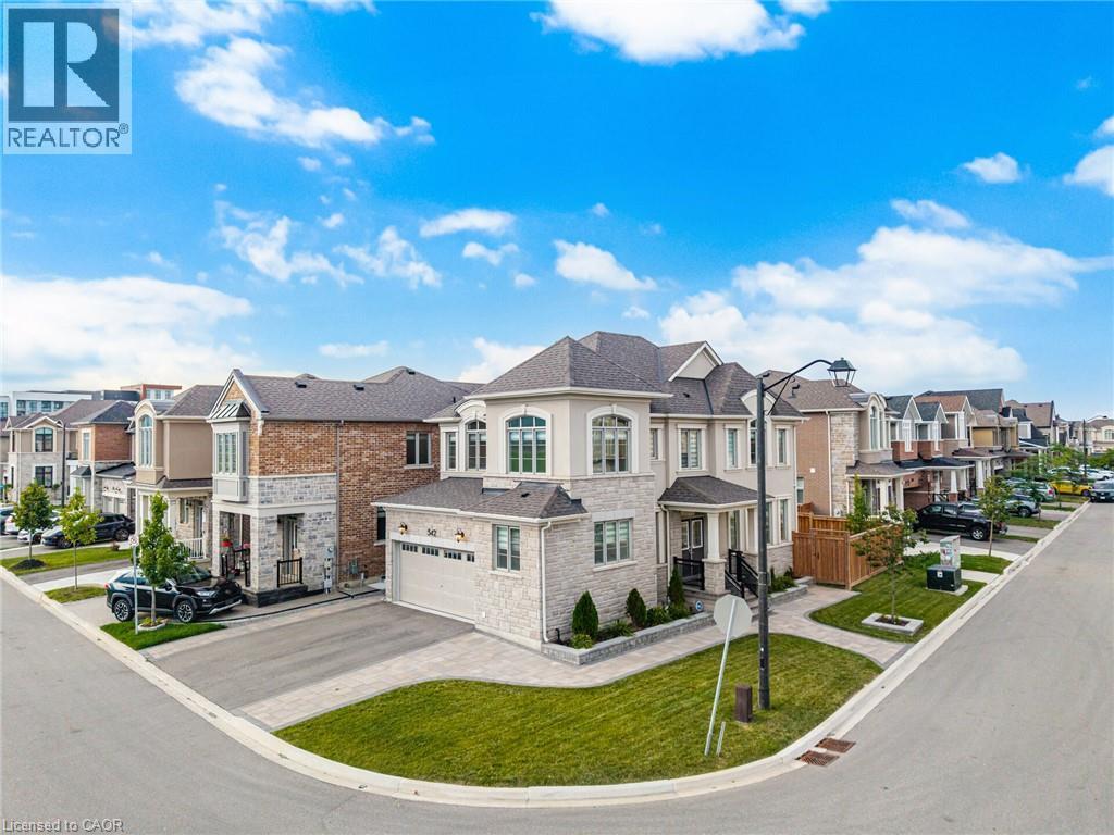 Stone and stucco facade residence with an attached double-car garage - 542 Boyd Lane, Milton, ON - Outdoor With Facade