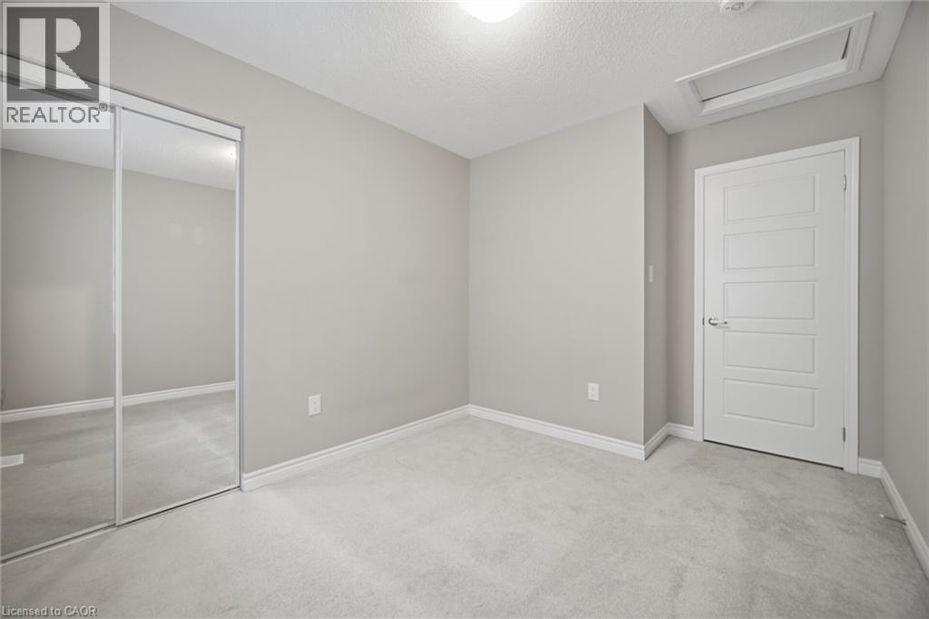 Room featuring light gray walls, white trim, and light gray carpet - 542 Boyd Lane, Milton, ON - Indoor Photo Showing Other Room