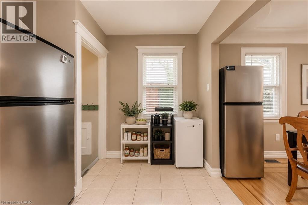 Kitchen area featuring tile flooring, neutral wall paint, and white trim work - 74 Royal Avenue, Hamilton, ON - Indoor Photo Showing Kitchen