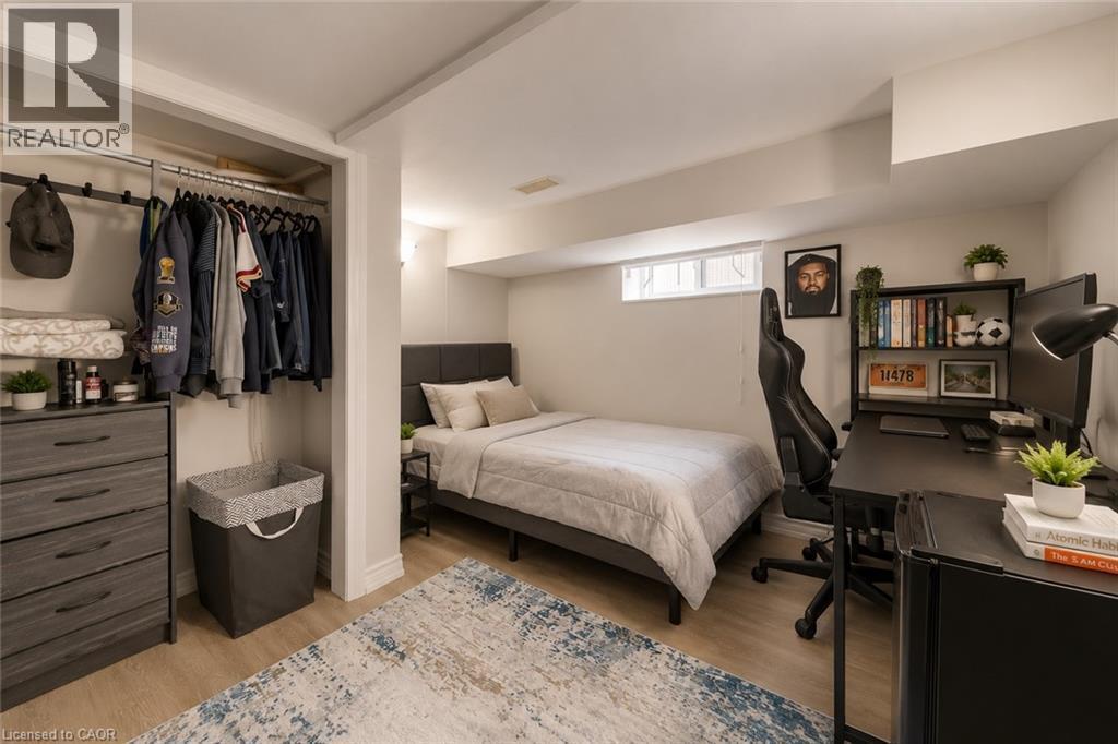 Bedroom featuring light wood-finish flooring and neutral wall tones - 74 Royal Avenue, Hamilton, ON - Indoor Photo Showing Other Room