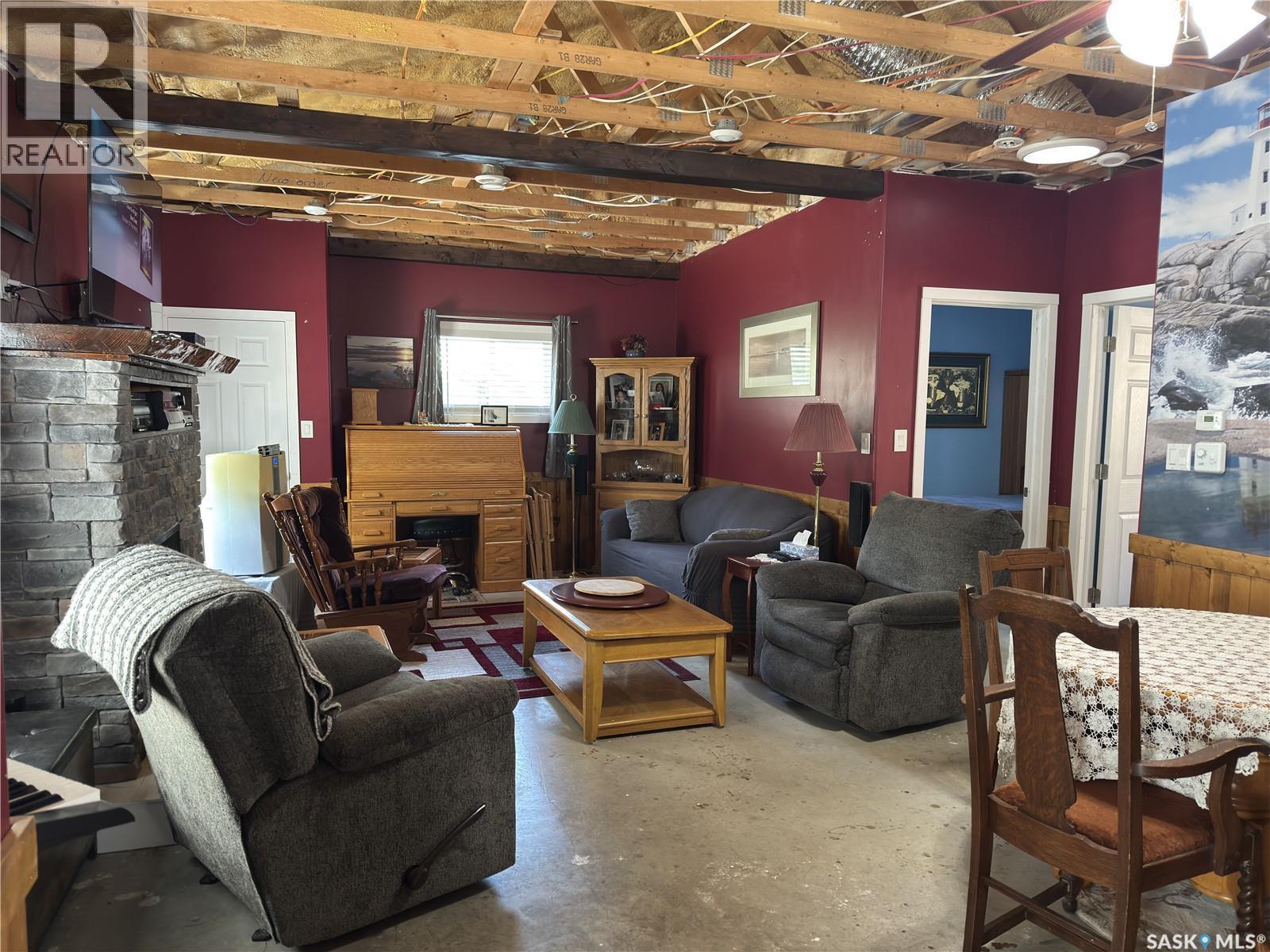 139 Lakeview Drive, Island View, SK - Indoor Photo Showing Living Room With Fireplace