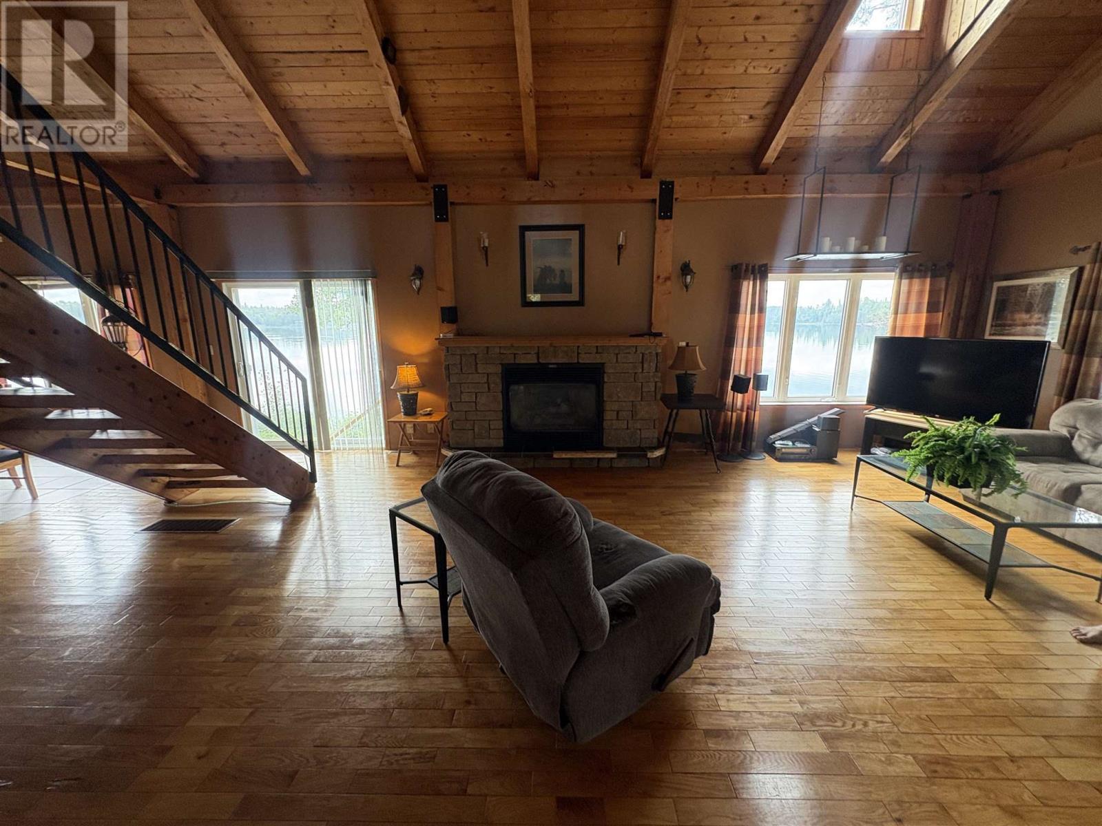 25 Mulligans Bay Rd, Chapleau, ON - Indoor Photo Showing Living Room With Fireplace