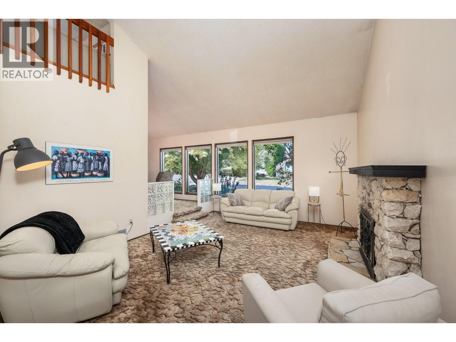 7807 Corona Court, Coldstream, BC - Indoor Photo Showing Living Room With Fireplace