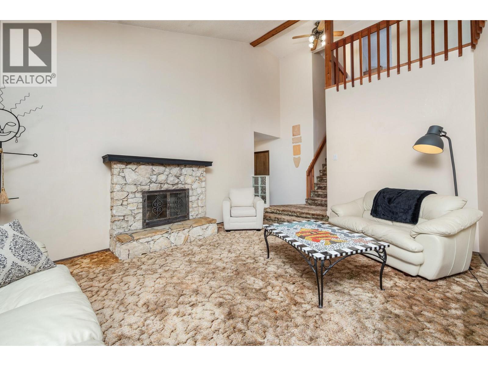 7807 Corona Court, Coldstream, BC - Indoor Photo Showing Living Room With Fireplace