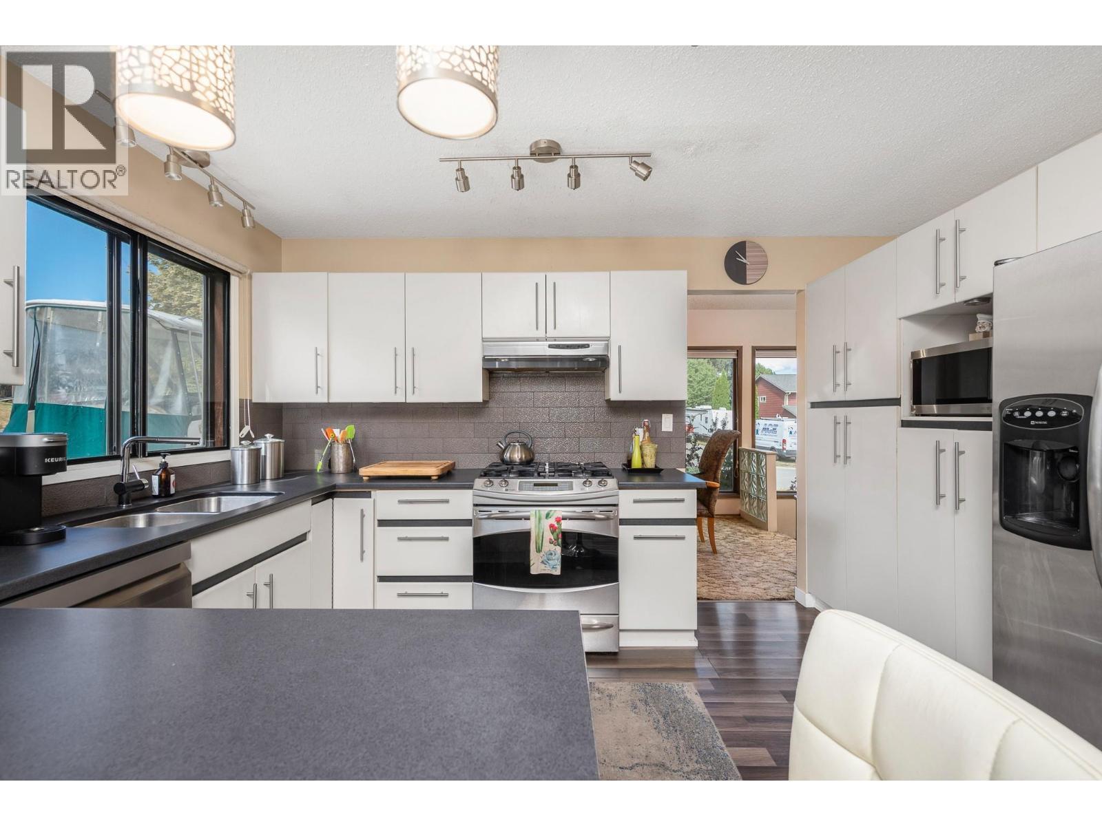 7807 Corona Court, Coldstream, BC - Indoor Photo Showing Kitchen With Double Sink