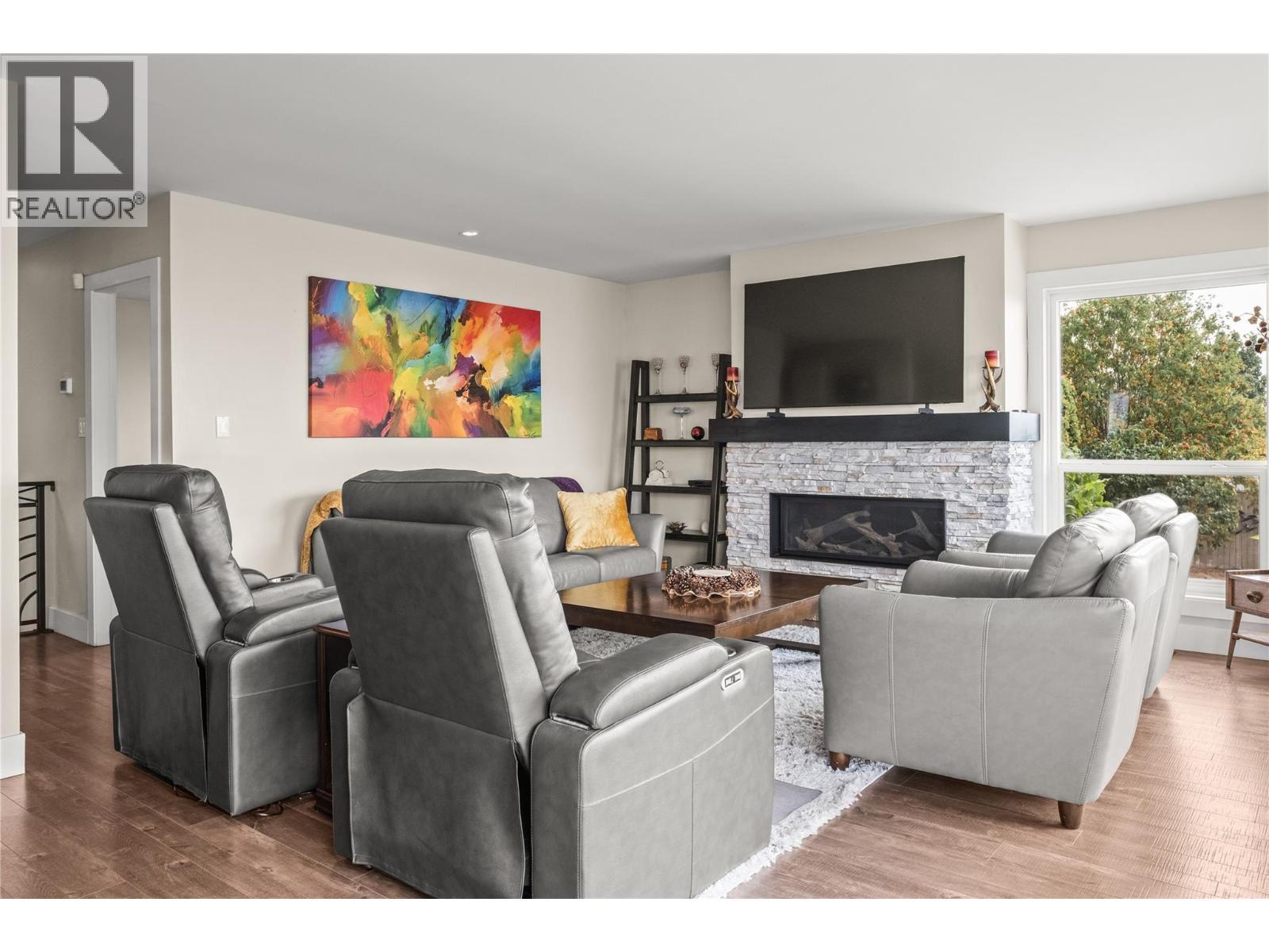 Living Room - 4119 15 Avenue, Vernon, BC - Indoor Photo Showing Living Room With Fireplace