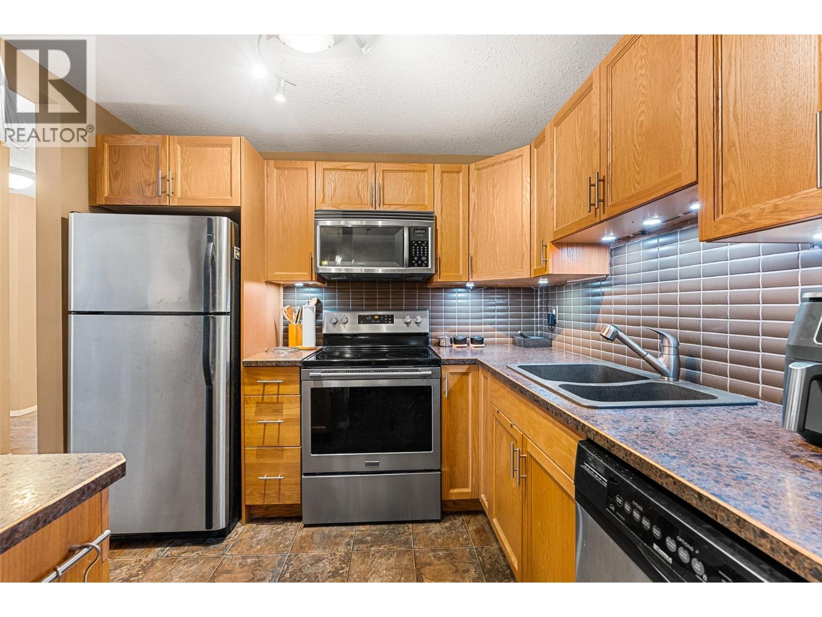 284 Yortkon Avenue Unit# 205, Penticton, BC - Indoor Photo Showing Kitchen With Stainless Steel Kitchen With Double Sink